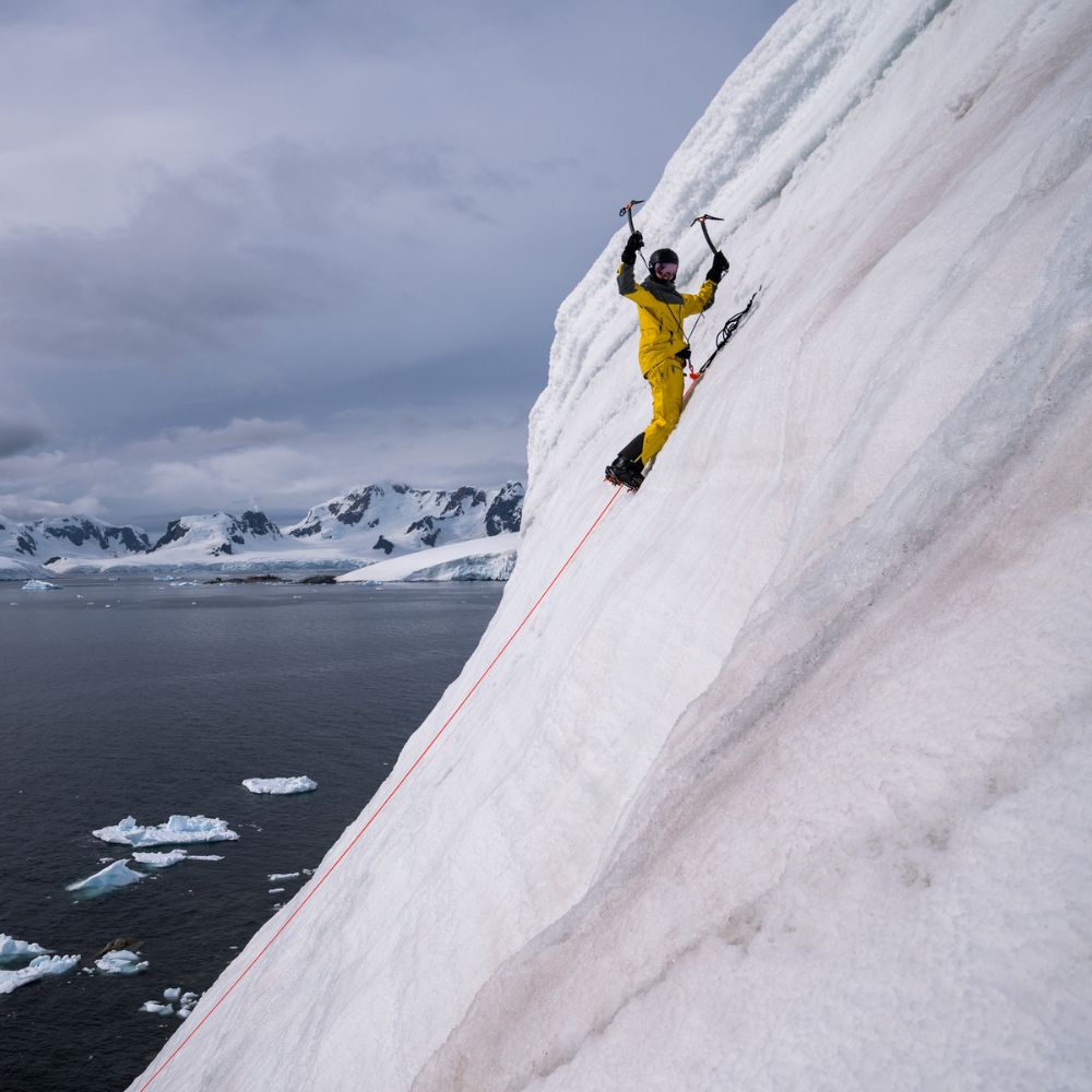 Guests learning to ice climb in the arctic with a specialist guide