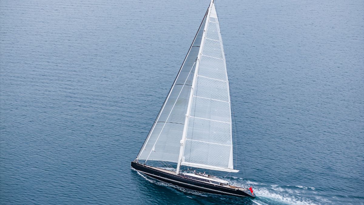 Luxury large sailing yacht sailing in the blue ocean with sails up and moving