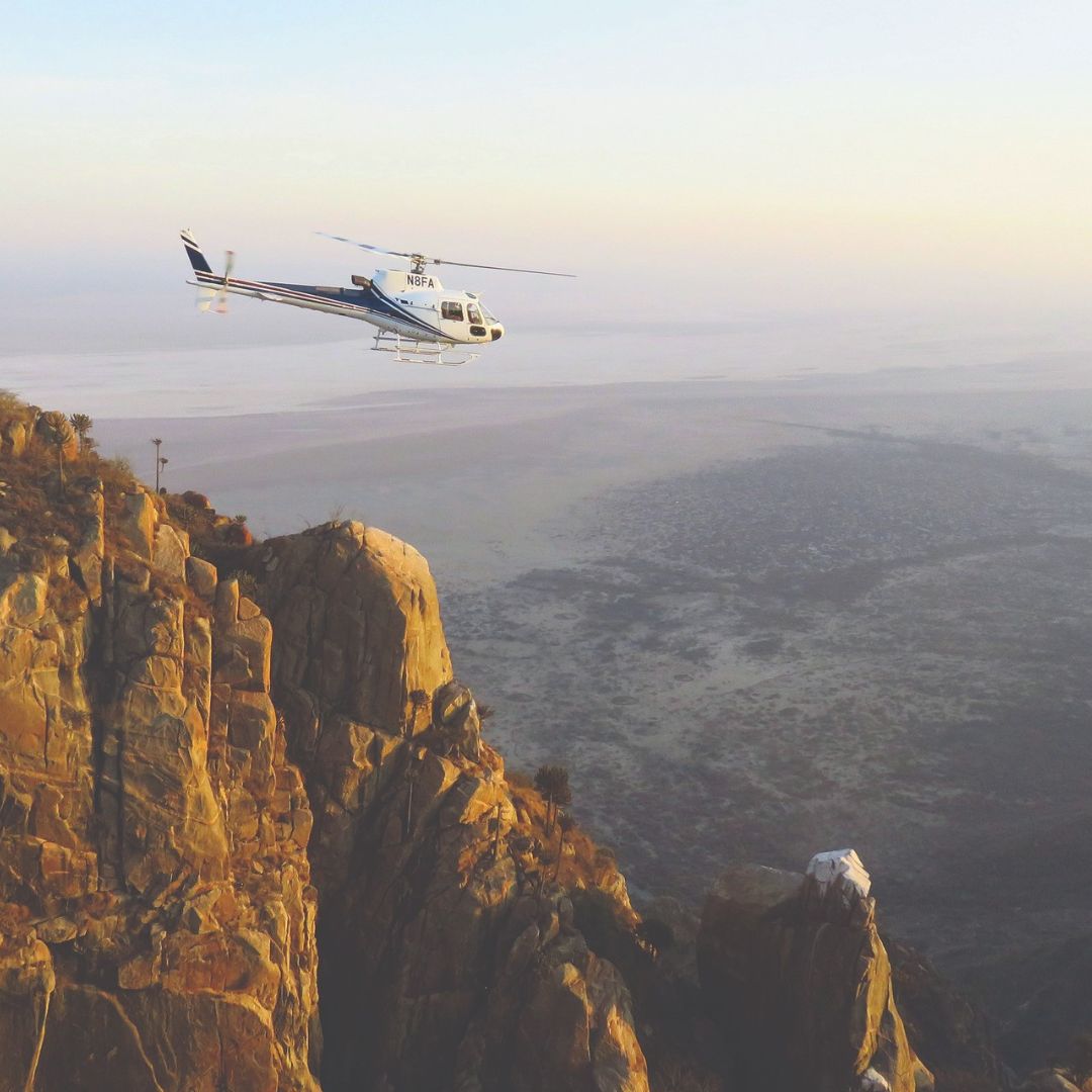 Helicopter flying over the Tanzanian mountains